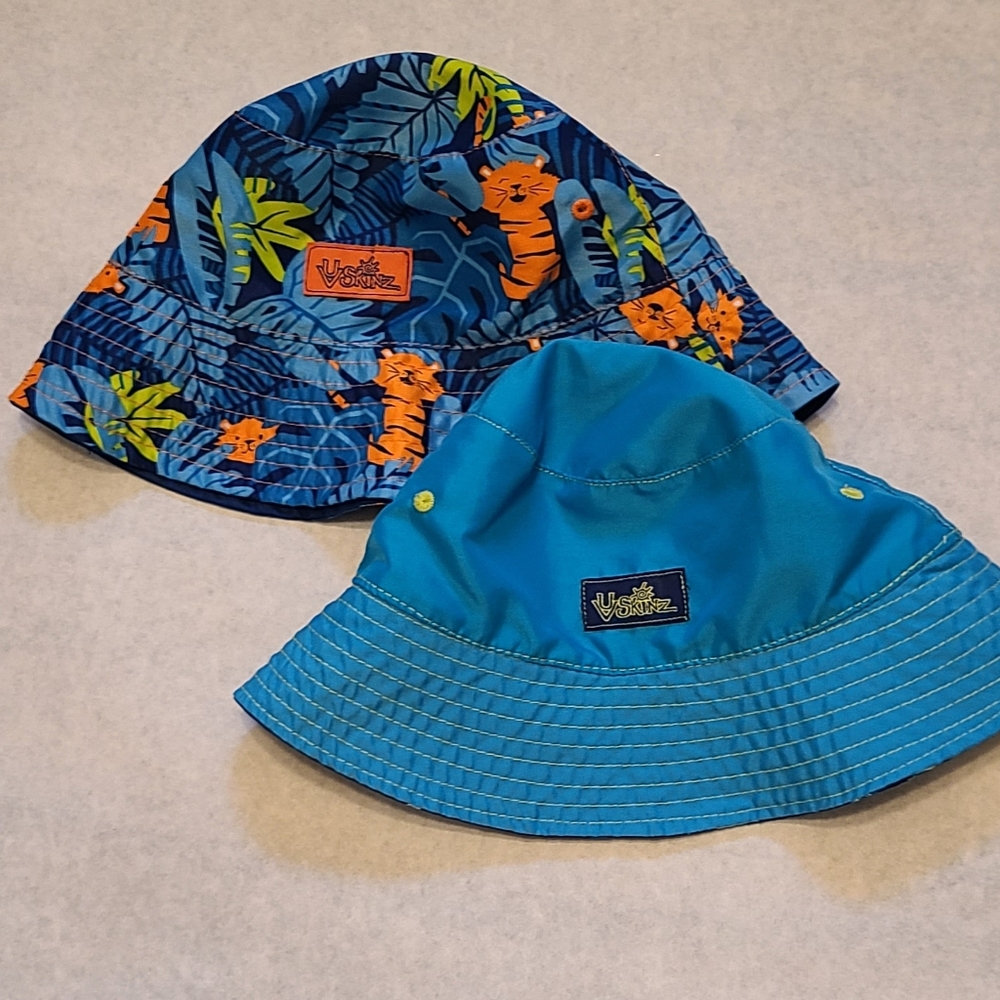 Two UV Skinz reversible summer bucket hats